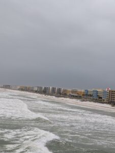 A look at the shore with storm clouds overhead.